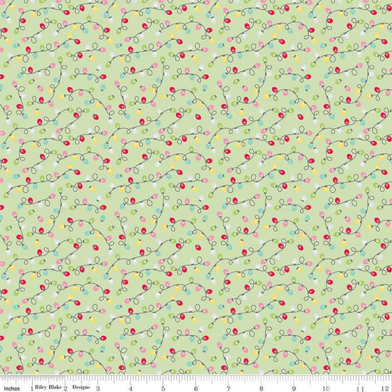 Image of the Gingerbread Kisses Lights Green quilting cotton fabric. Features lights on a green background. Cute Little Fabric Shop