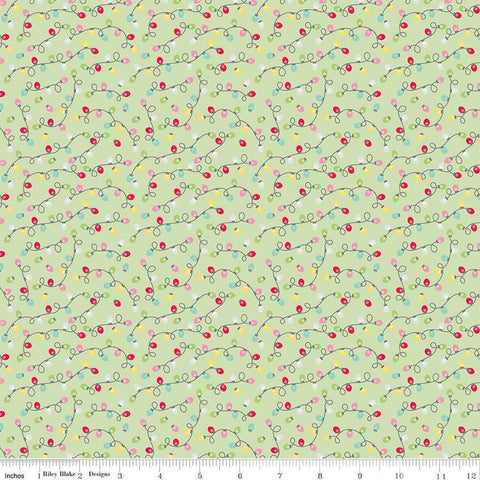 Image of the Gingerbread Kisses Lights Green quilting cotton fabric. Features lights on a green background. Cute Little Fabric Shop