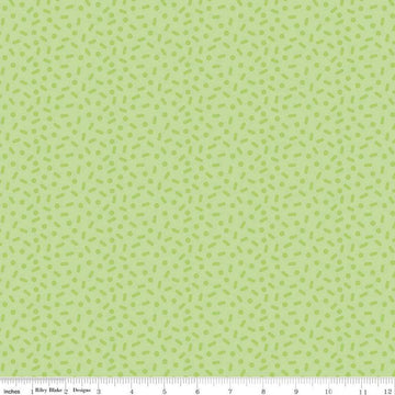 Image of the Gingerbread Kisses Sprinkles Green quilting cotton fabric. Features sprinkles on a green background. Cute Little Fabric Shop