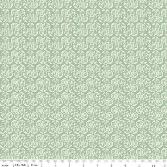 Image of the Nature's Portrait Trifolium Sage quilting cotton fabric by Riley Blake Designs. Features leaves on a green background. Cute Little Fabric Shop