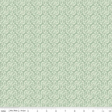 Image of the Nature's Portrait Trifolium Sage quilting cotton fabric by Riley Blake Designs. Features leaves on a green background. Cute Little Fabric Shop