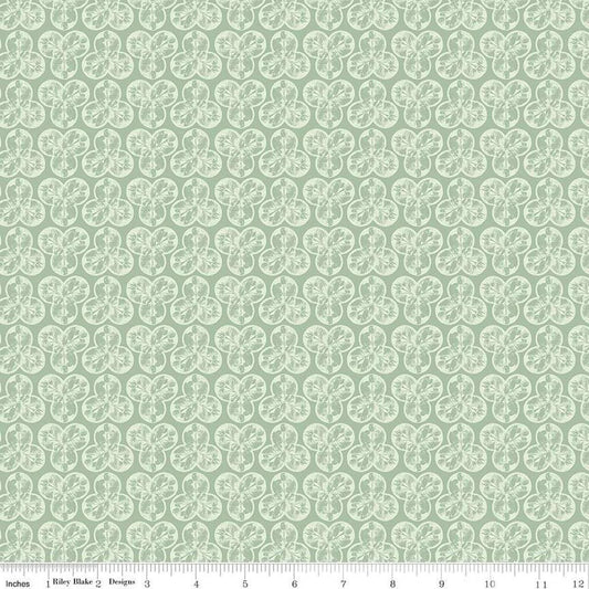 Image of the Nature's Portrait Trifolium Sage quilting cotton fabric by Riley Blake Designs. Features leaves on a green background. Cute Little Fabric Shop