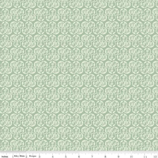 Image of the Nature&#39;s Portrait Trifolium Sage quilting cotton fabric by Riley Blake Designs. Features leaves on a green background. Cute Little Fabric Shop