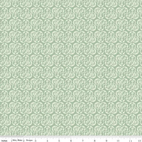 Image of the Nature&#39;s Portrait Trifolium Sage quilting cotton fabric by Riley Blake Designs. Features leaves on a green background. Cute Little Fabric Shop