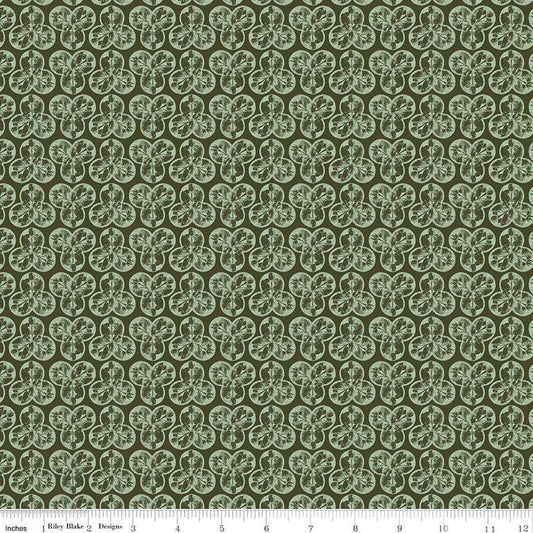 Image of the Nature's Portrait Trifolium Hunter quilting cotton fabric by Riley Blake Designs. Features leaves on a green background. Cute Little Fabric Shop
