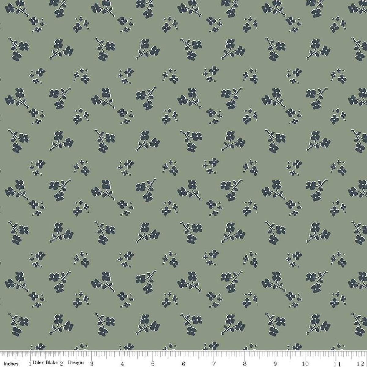 Image of the Honey Locust Saddle Grove quilting cotton fabric by Riley Blake Designs. Features flowers on a green background.