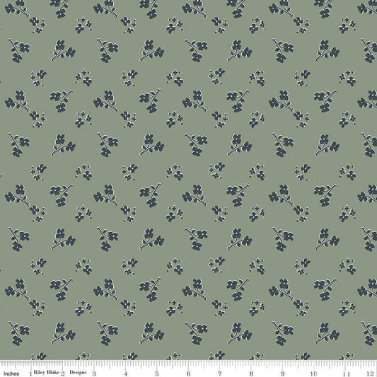Image of the Honey Locust Saddle Grove quilting cotton fabric by Riley Blake Designs. Features flowers on a green background.