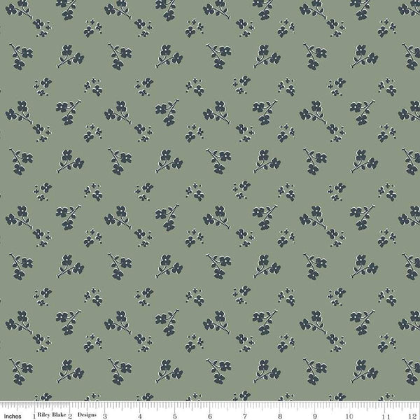 Image of the Honey Locust Saddle Grove quilting cotton fabric by Riley Blake Designs. Features flowers on a green background.
