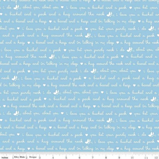 Image of the Love Notes Text Blue quilting cotton fabric by Riley Blake Designs. Features text on a blue background. Cute Little Fabric Shop