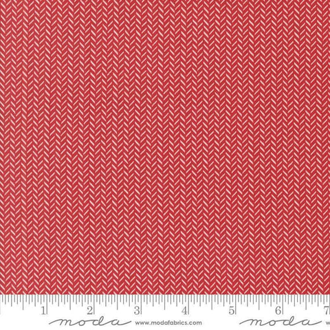 Image of the Berry and Pine Yule Cranberry quilting cotton fabric by Moda Fabrics. Features herringbone on a red background. Cute Little Fabric Shop