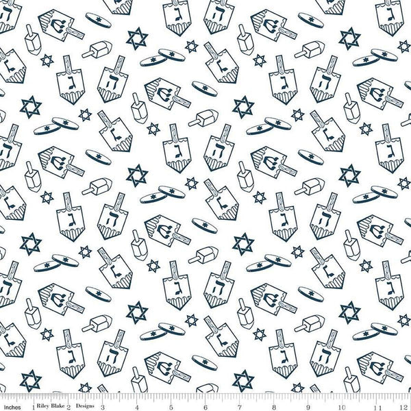 Image of the 8 Nights, 8 Lights Dreidel Toss White quilting cotton fabric by Riley Blake Designs. Features dreidels on a white background. Cute Little Fabric Shop