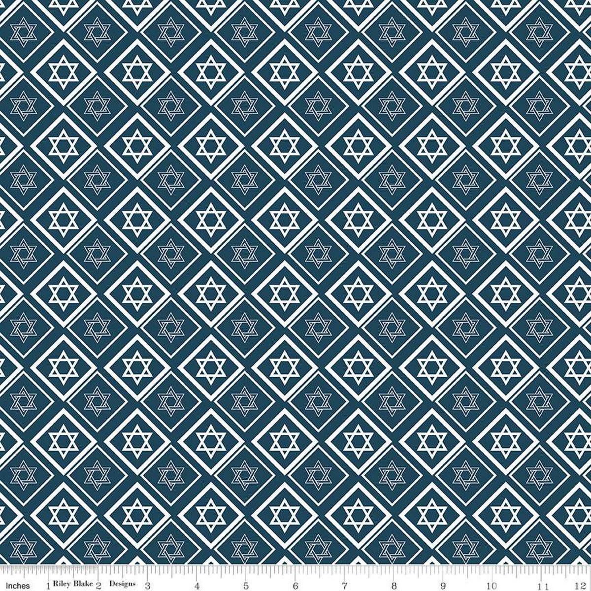 Image of the 8 Nights, 8 Lights Star of David Navy quilting cotton fabric by Riley Blake Designs. Features stars on a navy background. Cute Little Fabric Shop