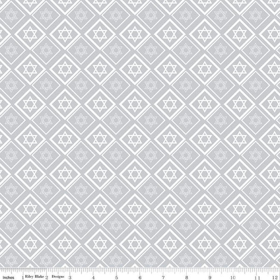 Image of the 8 Nights, 8 Lights Star of David Silver quilting cotton fabric by Riley Blake Designs. Features stars on a white background. Cute Little Fabric Shop