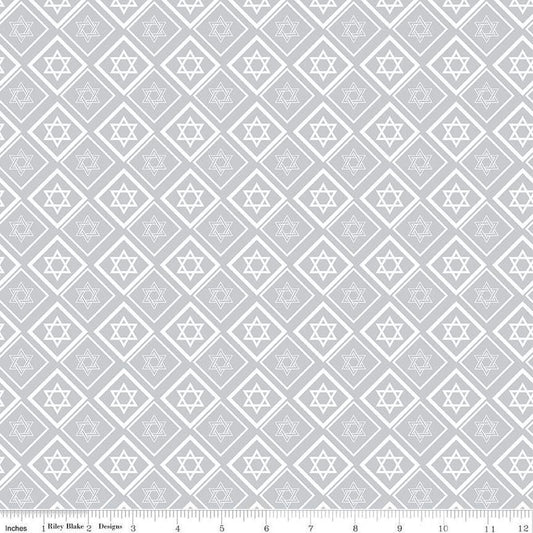 Image of the 8 Nights, 8 Lights Star of David Silver quilting cotton fabric by Riley Blake Designs. Features stars on a white background. Cute Little Fabric Shop