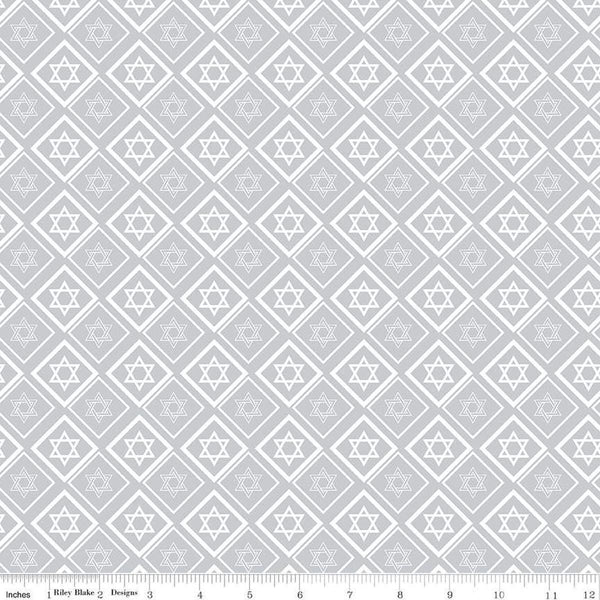 Image of the 8 Nights, 8 Lights Star of David Silver quilting cotton fabric by Riley Blake Designs. Features stars on a white background. Cute Little Fabric Shop