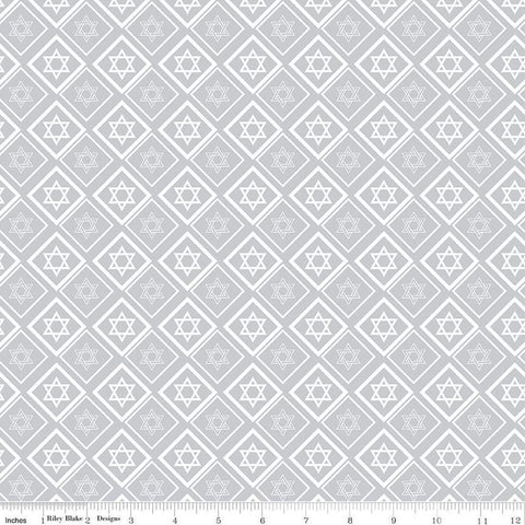 Image of the 8 Nights, 8 Lights Star of David Silver quilting cotton fabric by Riley Blake Designs. Features stars on a white background. Cute Little Fabric Shop
