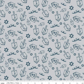 Image of the 8 Nights, 8 Lights Dreidel Toss Silver quilting cotton fabric by Riley Blake Designs. Features dreidels on a gray background. Cute Little Fabric Shop