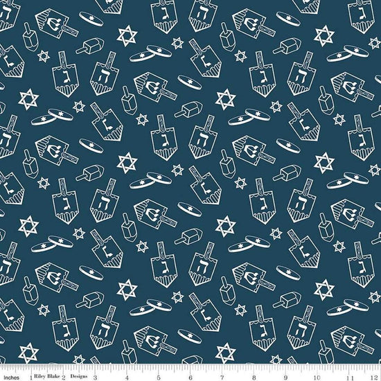 Image of the 8 Nights, 8 Lights Dreidel Toss Navy quilting cotton fabric by Riley Blake Designs. Features dreidels on a blue background. Cute Little Fabric Shop