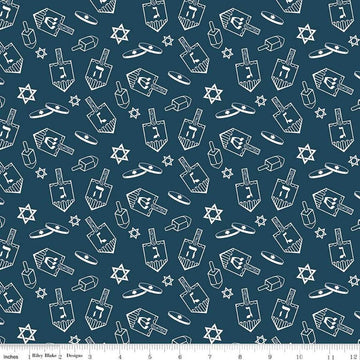 Image of the 8 Nights, 8 Lights Dreidel Toss Navy quilting cotton fabric by Riley Blake Designs. Features dreidels on a blue background. Cute Little Fabric Shop