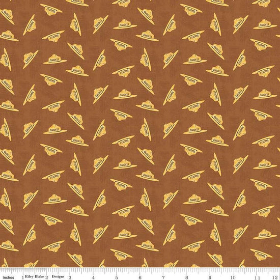 Image of the Friends of Smokey Bear Hat Toss Sienna quilting cotton fabric. Features hats on a brown background. Cute Little Fabric Shop