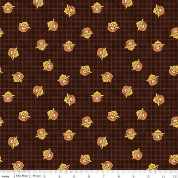 Image of the Friends of Smokey Bear Head Toss Bark quilting cotton fabric. Features smokey heads on a green background. Cute Little Fabric Shop