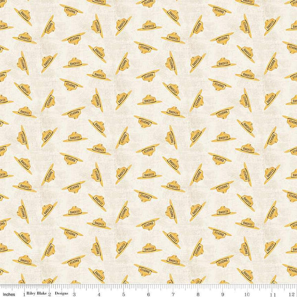 Image of the Friends of Smokey Bear Hat Toss Cream quilting cotton fabric. Features hats on a cream background. Cute Little Fabric Shop