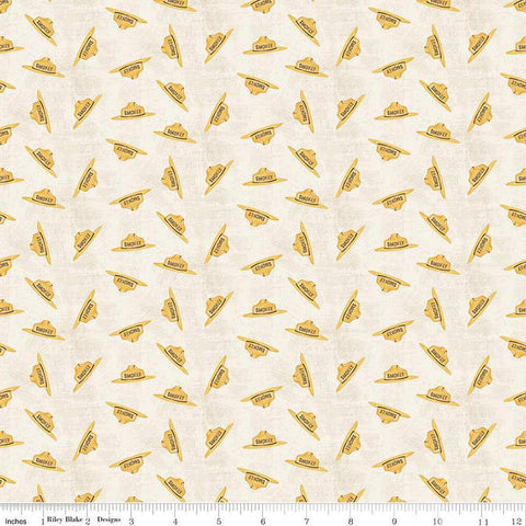 Image of the Friends of Smokey Bear Hat Toss Cream quilting cotton fabric. Features hats on a cream background. Cute Little Fabric Shop