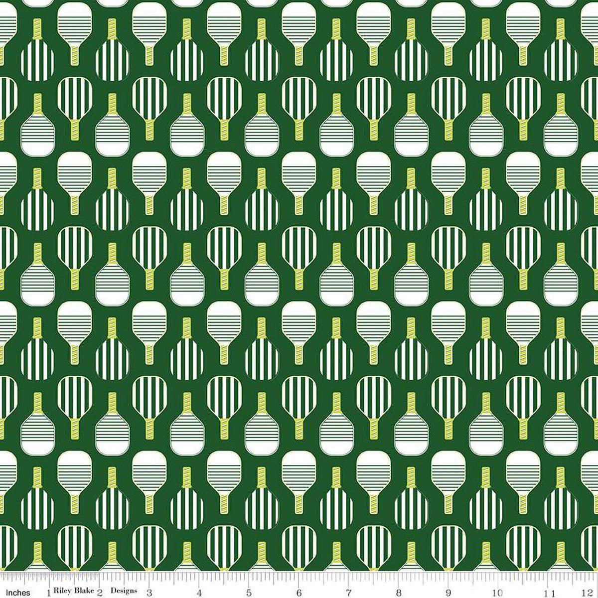 Image of the Pickleball Paddles Green quilting cotton fabric by Riley Blake Designs. Features paddles on a green background. Cute Little Fabric Shop