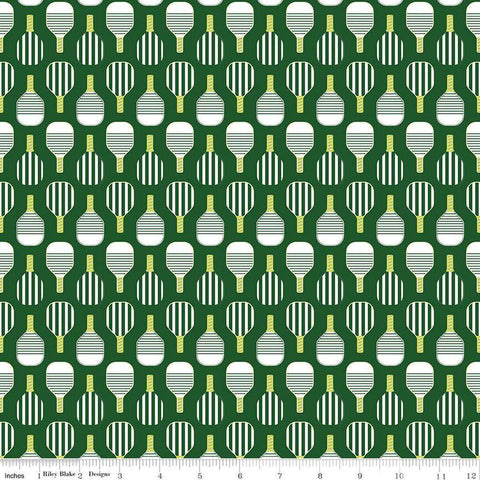 Image of the Pickleball Paddles Green quilting cotton fabric by Riley Blake Designs. Features paddles on a green background. Cute Little Fabric Shop