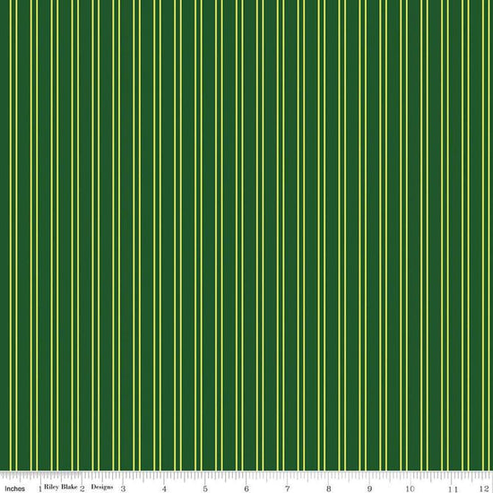 Image of the Pickleball Stripes Green quilting cotton fabric by Riley Blake Designs. Features pickleball items on a green background. Cute Little Fabric Shop