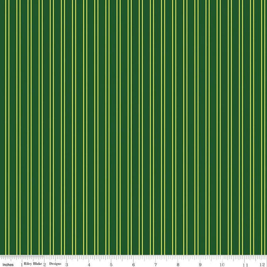 Image of the Pickleball Stripes Green quilting cotton fabric by Riley Blake Designs. Features pickleball items on a green background. Cute Little Fabric Shop