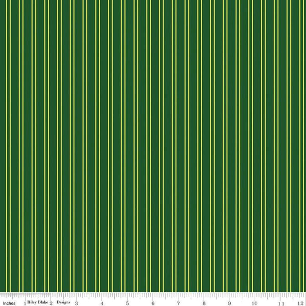 Image of the Pickleball Stripes Green quilting cotton fabric by Riley Blake Designs. Features pickleball items on a green background. Cute Little Fabric Shop