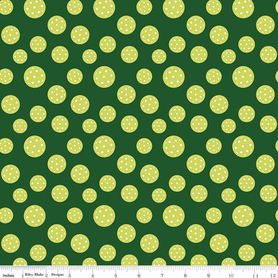 Image of the Pickleball Pickleballs Green quilting cotton fabric by Riley Blake Designs. Features pickleballs on a green background. Cute Little Fabric Shop