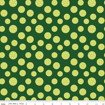 Image of the Pickleball Pickleballs Green quilting cotton fabric by Riley Blake Designs. Features pickleballs on a green background. Cute Little Fabric Shop