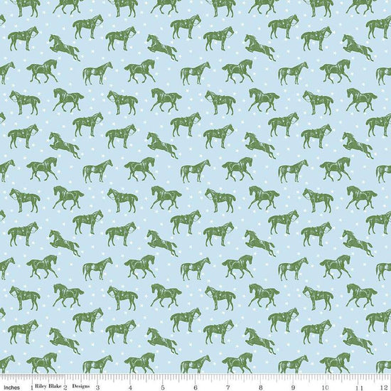 Image of the Bluegrass Charm Horses Mist quilting cotton fabric by Riley Blake Designs. Features horses on a blue background. Cute Little Fabric Shop