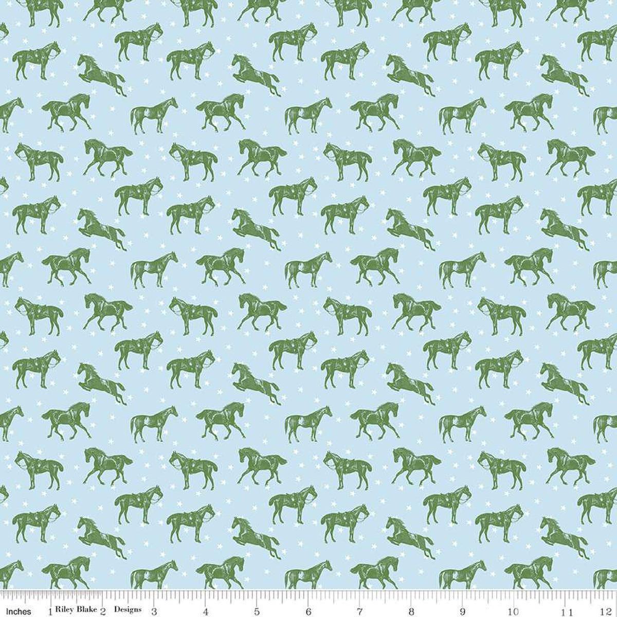 Image of the Bluegrass Charm Horses Mist quilting cotton fabric by Riley Blake Designs. Features horses on a blue background. Cute Little Fabric Shop