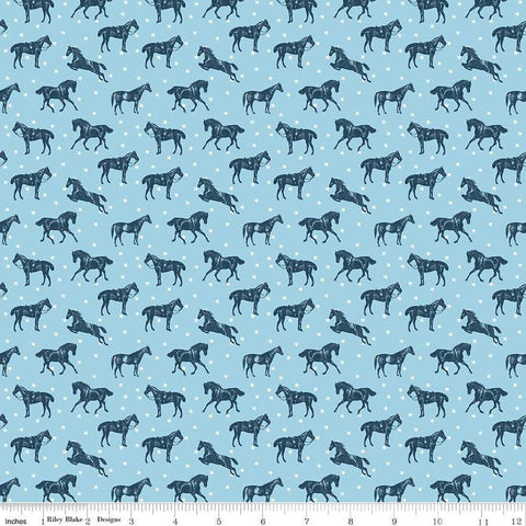 Image of the Bluegrass Charm Horses Sky quilting cotton fabric by Riley Blake Designs. Features horses on a blue background. Cute Little Fabric Shop