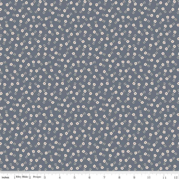 Image of the Cozy Bebe Flowers Blue quilting cotton by Riley Blake Designs. Features flowers on a blue background. Cute Little Fabric Shop