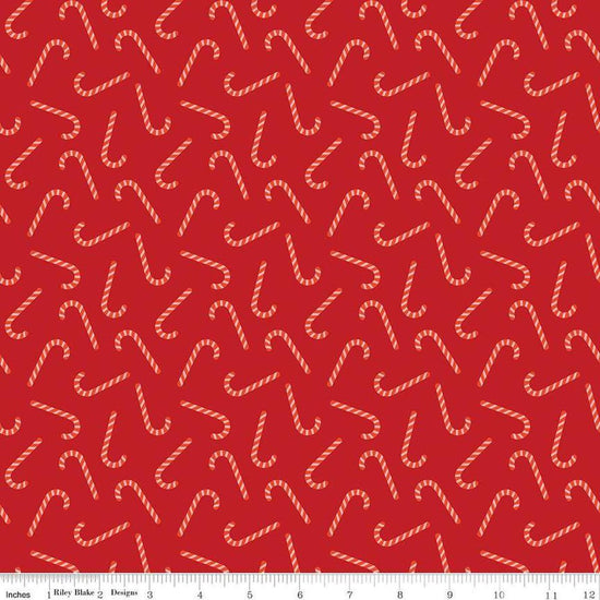Image of the Flannel Candy Canes Red quilting cotton fabric by Riley Blake Designs. Features candy canes on a red background. Cute Little Fabric Shop