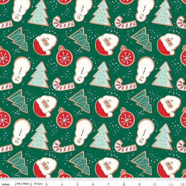 Image of the Flannel Christmas Cookies Green quilting cotton fabric by Riley Blake Designs. Features cookies on a green background. Cute Little Fabric Shop