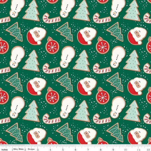 Image of the Flannel Christmas Cookies Green quilting cotton fabric by Riley Blake Designs. Features cookies on a green background. Cute Little Fabric Shop