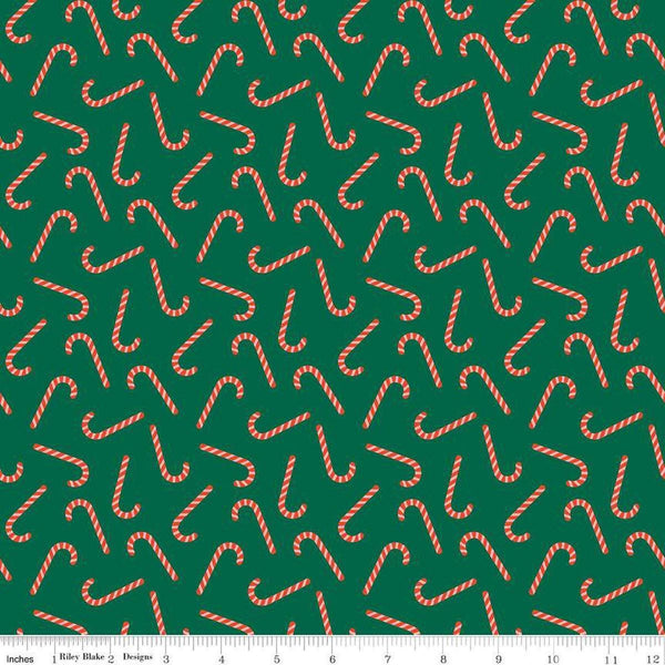Image of the Flannel Candy Canes Green quilting cotton fabric by Riley Blake Designs. Features candy canes on a green background. Cute Little Fabric Shop