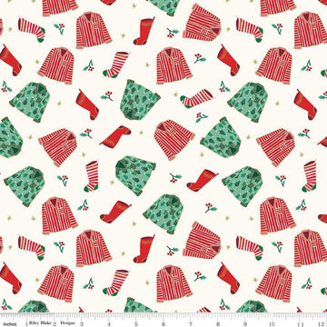 Image of the Flannel Christmas Pajamas Cream quilting cotton fabric by Riley Blake Designs. Features pajamas on a cream background. Cute Little Fabric Shop