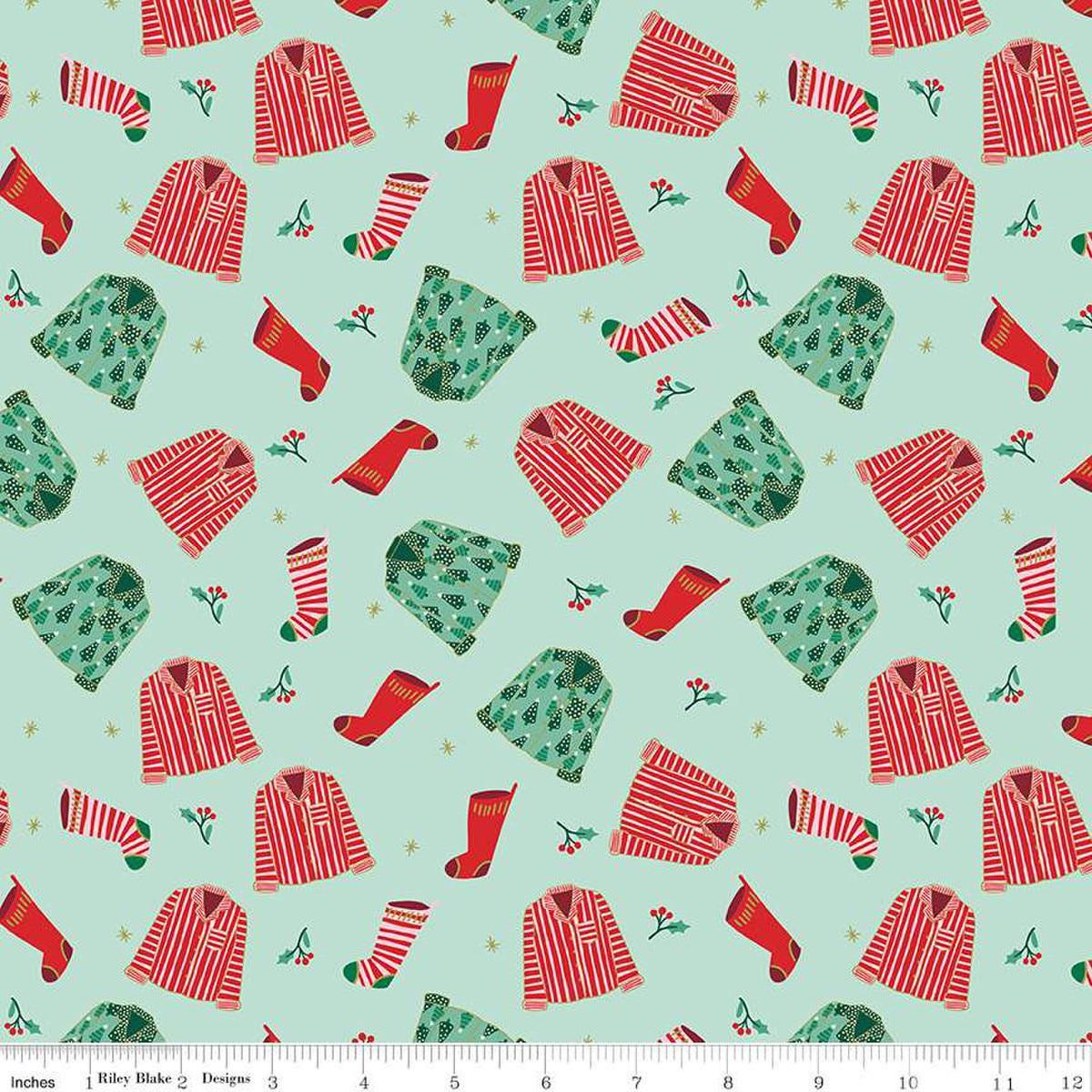 Image of the Flannel Christmas Pajamas Songbird quilting cotton fabric by Riley Blake Designs. Features pajamas on a blue background. Cute Little Fabric Shop