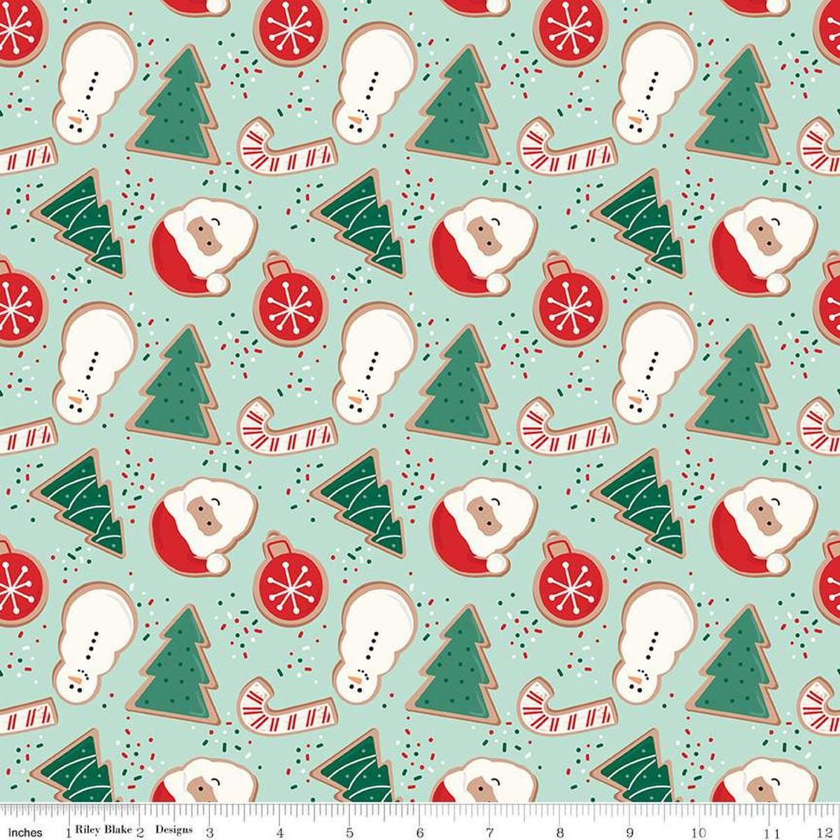 Image of the Flannel Christmas Cookies Songbird quilting cotton fabric by Riley Blake Designs. Features cookies on a blue background. Cute Little Fabric Shop