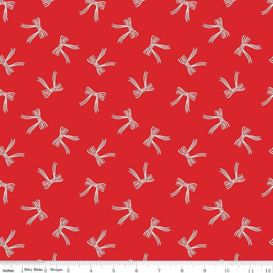 Image of the Flannel Bows Red quilting cotton fabric by Riley Blake Designs. Features bows on a re background. Cute Little Fabric Shop