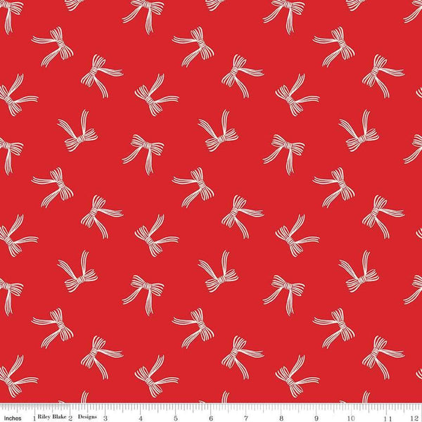 Image of the Flannel Bows Red quilting cotton fabric by Riley Blake Designs. Features bows on a re background. Cute Little Fabric Shop