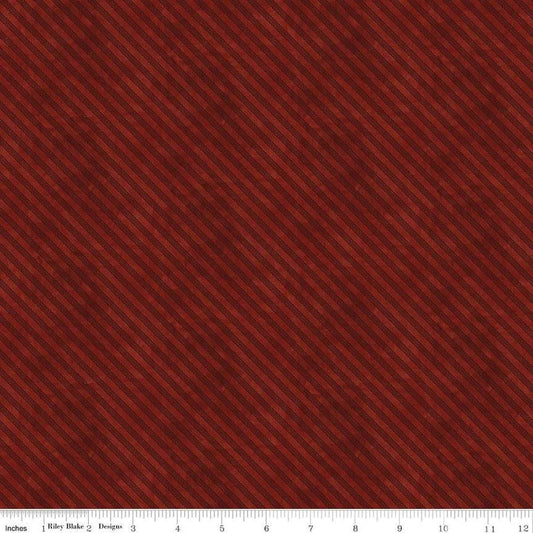 Image of the Naughty and Nice Ticking Red quilting cotton fabric by Riley Blake Designs. Features stripes on a red background. Cute Little Fabric Shop