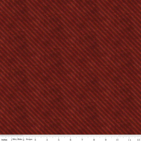 Image of the Naughty and Nice Ticking Red quilting cotton fabric by Riley Blake Designs. Features stripes on a red background. Cute Little Fabric Shop