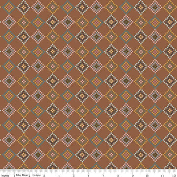 Image of the Honey Locust Patchwork Saddle quilting cotton fabric by Riley Blake Designs. Features flowers on a brown background